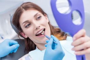 portrait of beautiful woman checking teeth after c 2021 08 29 11 44 27 utc 1